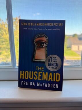 The Housemaid by Freida McFadden - Blue & Yellow Paperback